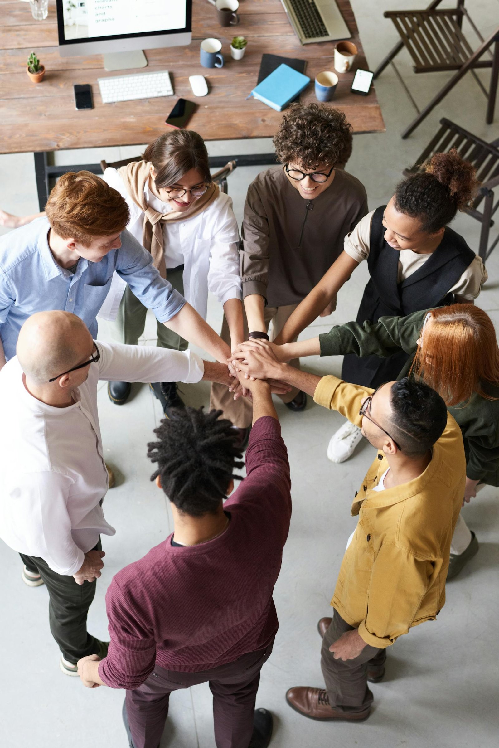 Photo Of People Holding Each Other's Hands