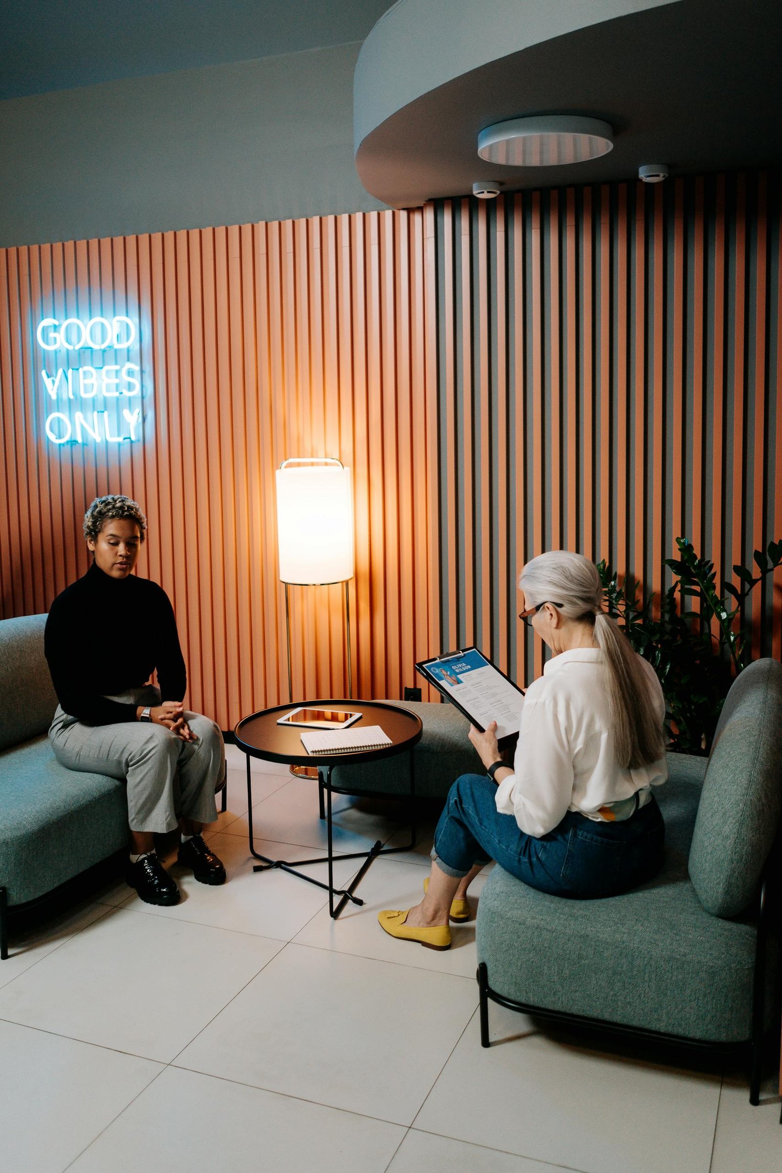 Woman in Black Long Sleeve Shirt Having a Job Interview