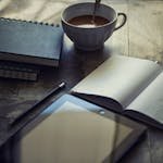 Cup Filled With Coffee Near Book