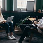 Photo of Two People Using Their Gadgets